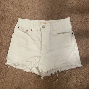 Levi’s High Waisted White Denim Distressed Shorts